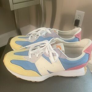 Brand new, never worn. Youth size 4.5 multicolored new balance sneakers.